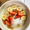 Bowl with cookie dough overnight oats with banana and strawberries