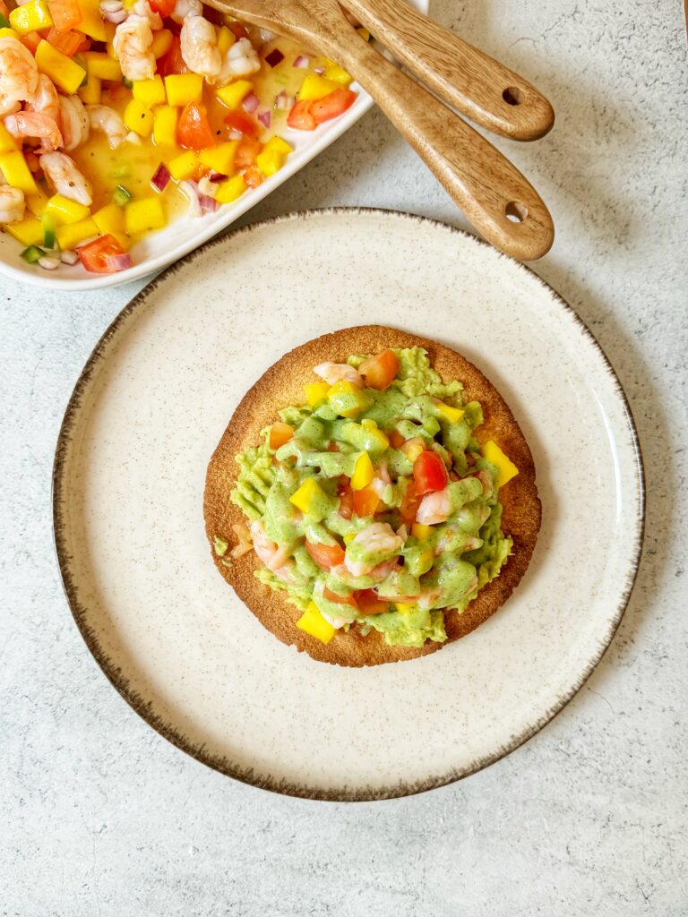 Baked Tostada with avocado cream, prawns and mango salad with Coriander sauce