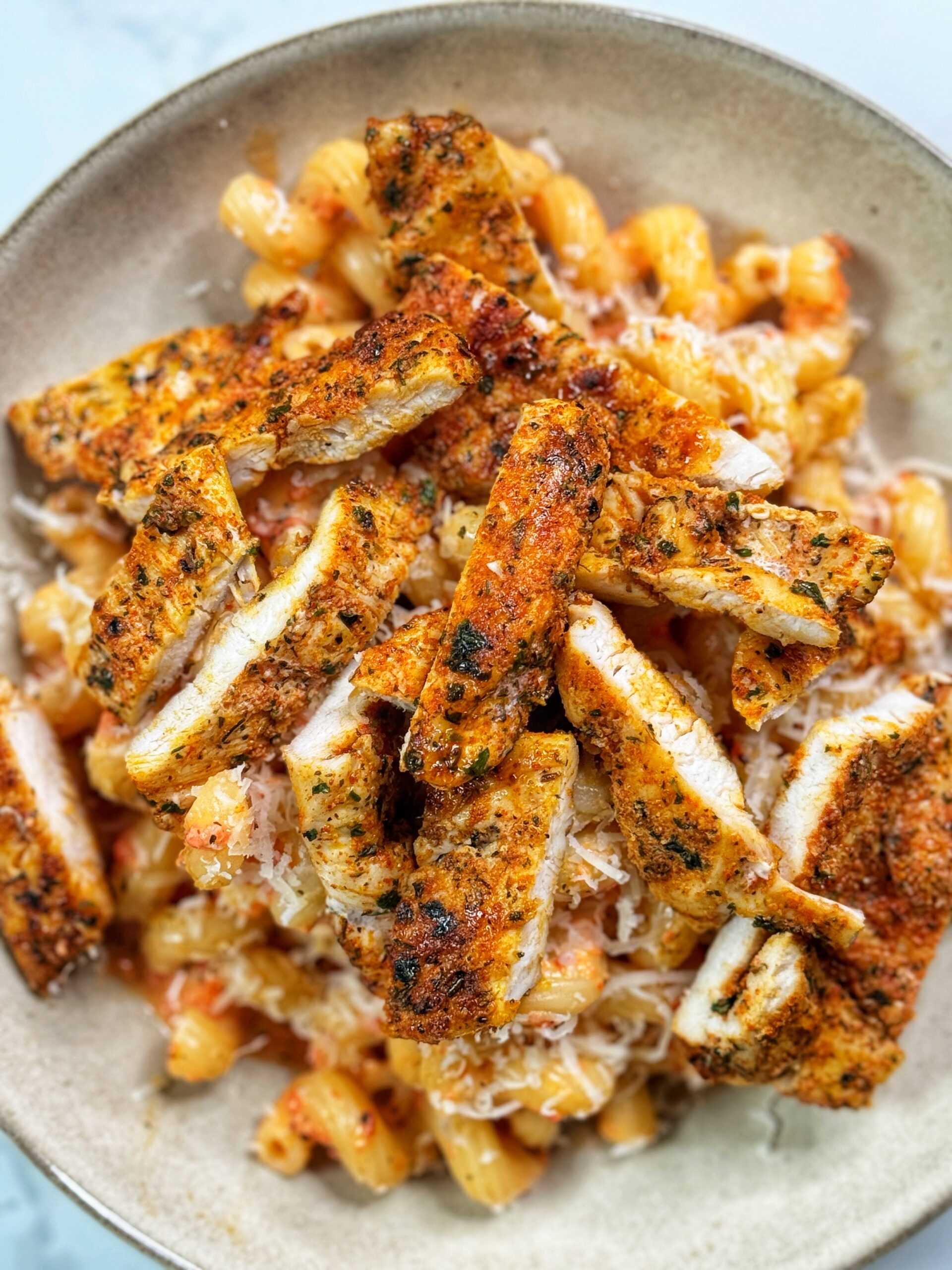 High protein roasted red pepper and ricotta cheese pasta with grilled chicken